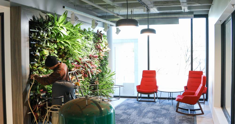 Man works on building a vertical garden