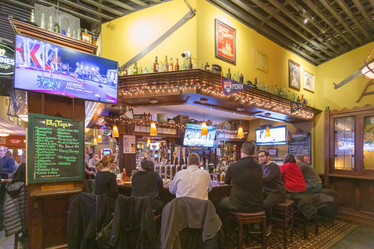 Customers sitting at the bar in Market Tavern