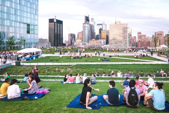 People enjoying a pop up beer garden at Cira Green