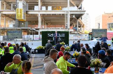 Brandywine Realty Trust President and CEO Jerry Sweeney speaks to guests at the Schuylkill Yards milestone event celebration